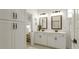 Bright bathroom featuring double sinks with lots of storage at 1818 Butterfly Way, Marietta, GA 30066