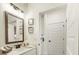 Modern bathroom featuring a sleek vanity, large mirror and stylish fixtures at 1818 Butterfly Way, Marietta, GA 30066