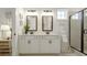 Bright bathroom featuring double sinks and a large shower with black trim at 1818 Butterfly Way, Marietta, GA 30066