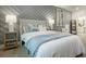 Well-appointed bedroom with a stylish headboard and a decorative gray accent wall at 1818 Butterfly Way, Marietta, GA 30066