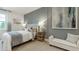 Modern bedroom featuring accent wall, neutral color palette, and ample natural light at 1818 Butterfly Way, Marietta, GA 30066