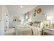 Well-lit bedroom showcases contemporary design, a queen bed and large closet at 1818 Butterfly Way, Marietta, GA 30066