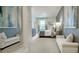 Spacious bedroom with light gray walls, white seating, and a decorative accent wall at 1818 Butterfly Way, Marietta, GA 30066