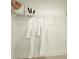 Walk-in closet with white wire shelving and two white bathrobes on hangers at 1818 Butterfly Way, Marietta, GA 30066