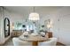 Dining area with an open concept leading into the living room, filled with natural light at 1818 Butterfly Way, Marietta, GA 30066