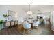 Dining area with a round table and an open floor plan to the kitchen and living room at 1818 Butterfly Way, Marietta, GA 30066