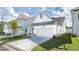 Inviting exterior view of a modern home with a two-car garage, a landscaped lawn, and a paved driveway at 1818 Butterfly Way, Marietta, GA 30066