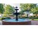 Public fountain in a park with surrounding trees, benches, and a gazebo at 1818 Butterfly Way, Marietta, GA 30066