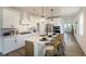Bright kitchen with an eat-in island, white cabinets, and stainless steel appliances at 1818 Butterfly Way, Marietta, GA 30066