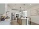 Bright kitchen with stainless appliances, an island, and stylish pendant lighting at 1818 Butterfly Way, Marietta, GA 30066