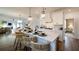 Open concept kitchen with an eat-in island and white cabinets, and stainless steel appliances at 1818 Butterfly Way, Marietta, GA 30066