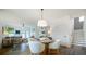 Dining area with stairs to the upper level and open access to the living room at 1818 Butterfly Way, Marietta, GA 30066