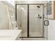Beautiful shower featuring gray subway tile, a bench, and a black-trimmed glass door at 1818 Butterfly Way, Marietta, GA 30066