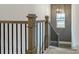 Staircase with decorative black metal balusters and gray wall trim at 1818 Butterfly Way, Marietta, GA 30066