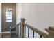 Staircase landing featuring statement light fixture and decorative wall trim at 1818 Butterfly Way, Marietta, GA 30066