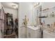 The bathroom is decorated with a white vanity and decorative marble, plus a laundry room combo for convenience at 3299 Pete Shaw Rd, Marietta, GA 30066