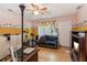 A bedroom offering laminated floor, ceiling fan, and sofa at 3299 Pete Shaw Rd, Marietta, GA 30066