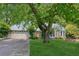 Charming home featuring a two-car garage, stone accents and mature tree in the front yard at 3299 Pete Shaw Rd, Marietta, GA 30066