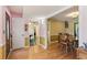 Open foyer with hardwood floors, dining room, and decorative wallpaper at 3299 Pete Shaw Rd, Marietta, GA 30066
