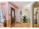 Open foyer with hardwood floors, dining room, and decorative wallpaper at 3299 Pete Shaw Rd, Marietta, GA 30066
