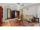 A living room with a hardwood floor, furniture and bookshelves at 3299 Pete Shaw Rd, Marietta, GA 30066