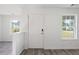 Bright entryway featuring modern gray flooring, white walls, and view to the outside at 3645 Ten Oaks Cir, Powder Springs, GA 30127