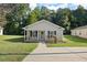 Charming single-story home with a well-manicured lawn, inviting entryway, and mature trees at 3645 Ten Oaks Cir, Powder Springs, GA 30127