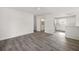 Open-concept living room with gray floors and easy access to the bathroom and kitchen at 3645 Ten Oaks Cir, Powder Springs, GA 30127