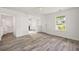 Inviting living room featuring modern gray flooring, natural light, and an open layout at 3645 Ten Oaks Cir, Powder Springs, GA 30127