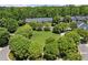 Community features lush greenery, a central green space, and well-maintained homes at 4905 Village Green Dr, Roswell, GA 30075