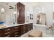 Beautiful primary bathroom featuring dual vanity, soaking tub, and natural light at 4905 Village Green Dr, Roswell, GA 30075