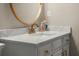 Close up of bathroom vanity with decorative gold framed mirror at 4905 Village Green Dr, Roswell, GA 30075