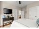 Bedroom featuring mounted TV and a view of the entry at 4905 Village Green Dr, Roswell, GA 30075
