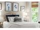Comfortable bedroom with decorative pillows and natural light at 4905 Village Green Dr, Roswell, GA 30075