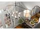 Stylish foyer showcasing hardwood floors, modern chandelier, and an elegant entryway at 4905 Village Green Dr, Roswell, GA 30075