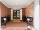 Welcoming brick front porch with seating and ample space at 4905 Village Green Dr, Roswell, GA 30075