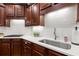 Gourmet kitchen features stainless steel sink and modern countertops at 4905 Village Green Dr, Roswell, GA 30075