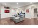 Spacious living room with arm chairs, fireplace, and view to a Gathering room at 4905 Village Green Dr, Roswell, GA 30075