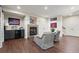 Open concept living room with wet bar and decorative fireplace at 4905 Village Green Dr, Roswell, GA 30075