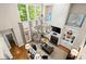 Spacious living room features high ceilings, lots of natural light, and a cozy fireplace at 4905 Village Green Dr, Roswell, GA 30075