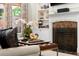 Close up of the fireplace in the living room with custom bookshelf and orchid at 4905 Village Green Dr, Roswell, GA 30075