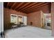 Brick patio with a seating area under a wooden eave at 4905 Village Green Dr, Roswell, GA 30075