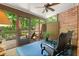 Relaxing screened porch with seating and view of surrounding trees at 4905 Village Green Dr, Roswell, GA 30075