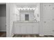 Bright bathroom with dual sinks, granite countertop, and modern fixtures at 115 Haven Brook Way, Douglasville, GA 30134