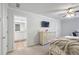 Spacious bedroom featuring modern decor, a flat-screen TV, and an en-suite bathroom at 115 Haven Brook Way, Douglasville, GA 30134