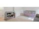 Comfortable Bedroom featuring a grey crib, shelves of toys, and a neutral color scheme at 115 Haven Brook Way, Douglasville, GA 30134