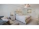 Inviting bedroom featuring a bed with cozy seating area and dresser at 115 Haven Brook Way, Douglasville, GA 30134