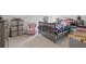 Cozy bedroom with a colorful decor, including a small pink chair and plenty of space for play at 115 Haven Brook Way, Douglasville, GA 30134