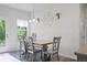 Cozy dining area with a wooden table, stylish chairs, and modern decor at 115 Haven Brook Way, Douglasville, GA 30134