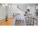 Bright dining area featuring modern furnishings and an open floor plan leading to the living room at 115 Haven Brook Way, Douglasville, GA 30134
